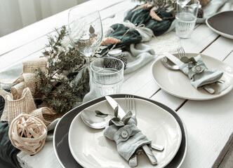 Stylish table setting for two with decor details.