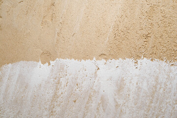 a wall with partially plastered gypsum plaster plaster