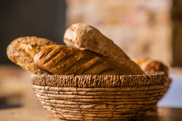 Fresh bread in basket on table