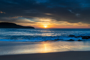 Sunrise at the beach with high cloud