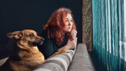 The hostess plays at home with her dog