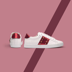 White womens sneakers with pink background