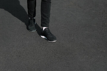 Black sneakers  on a city background