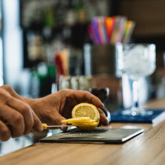 person cuting lemons