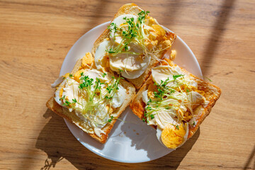 Easter sandwiches with egg and watercress on a plate