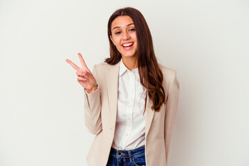 Young Indian business woman isolated on white background joyful and carefree showing a peace symbol...