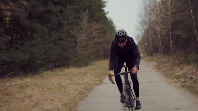 Cyclist Fitness Riding On Road Bike Ready For Triathlon Race.Hard Sport Workout.Triathlete Cyclist Training On Bicycle.Fit Athlete Sport Workout Training Cycling Triathlon Competition.Recreation Spor