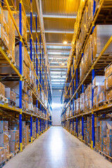 Interior of a modern warehouse storage with rows and goods boxes on high shelves