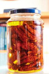 Sun dried tomatoes with olive oil in a jar