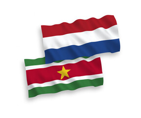 Flags of Republic of Suriname and Netherlands on a white background