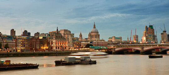 Fototapeta na wymiar London, panoramic aerial view over Thames river with St. Paul Cathedral, skyscapers of City and skyline.