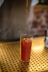 Glass of Bloody Maria cocktail.