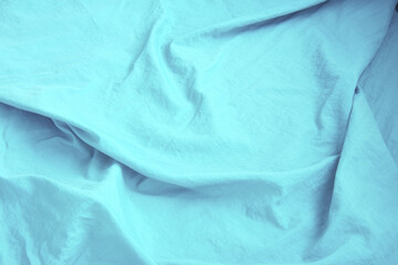 Blue silk texture background. Blue satin background close up