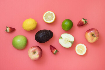 Still life with fresh seasonal fruits on pink background