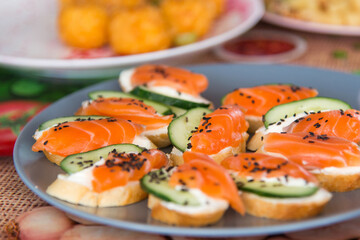 
Mini canapes with salted salmon, cucumber and bread. Decor with sesame seeds. A light snack for your appetite.