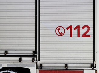 Number 112 on the firetruck. Common european and worldwide emergency number on the vehicle of the...