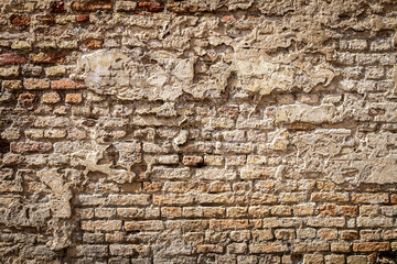 Old brick and plaster wall texture background