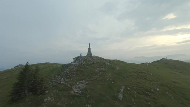 Statue of the Virgin Mary in the Styrian alps aerial view