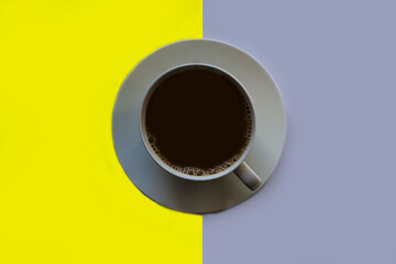 Morning coffee in a white cup on a white saucer.