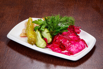 Pickled vegetables mix - cabbage, cucumber and pepper