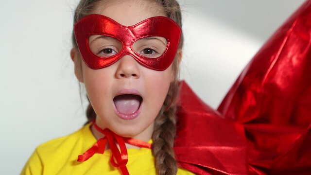 girl superhero portrait face. feminism a happy family a close-up home kid dream concept. child superhero in mask. Beautiful kid girl superhero. child play hero winner. business leader concept