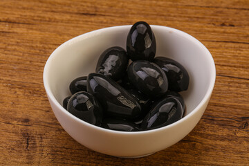 Pickled black olives in the bowl