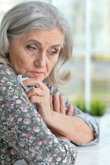 Close up portrait of sad senior woman