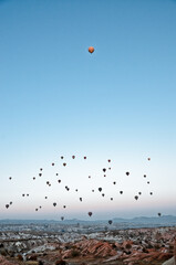 TURKEY, CAPPADOCIA, GOREME:  Aerial scenic view of hot air balloons flying over valleys of Göreme National Park