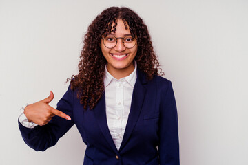 Young business mixed race woman isolated on white background person pointing by hand to a shirt copy space, proud and confident