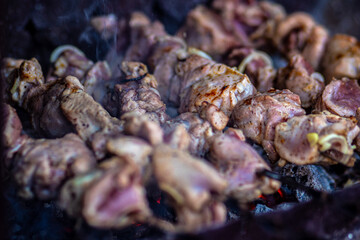 Grilled meat on skewers. Fresh shish kebab on skewers is fried on the grill. Cooking.