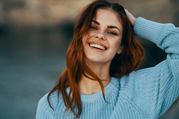cheerful red-haired woman outdoors recreation travel close-up