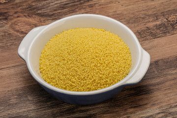 Raw cous cous heap in the bowl
