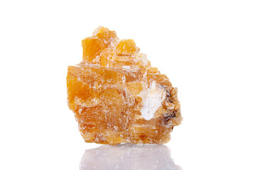 macro mineral stone yellow calcite on a white background