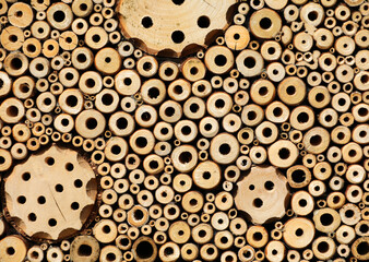 Insect hotel Bee hotel with small tubes in the wood