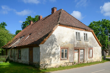 Fototapeta na wymiar View of old traditional rural house. Liepupe village, Latvia.