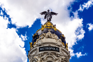 The dome of the Metropolis Building, an example of Romanesque, Beaux-Arts and Romanesque Revival architecture, at Calle de Alcala and Gran Via in Madrid, Spain.