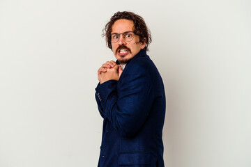 Young business man isolated on white background scared and afraid.