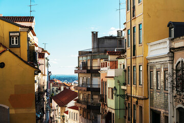 Fototapeta na wymiar Old Town Lisbon. Street view of typical houses in Lisbon, Portugal, Europe