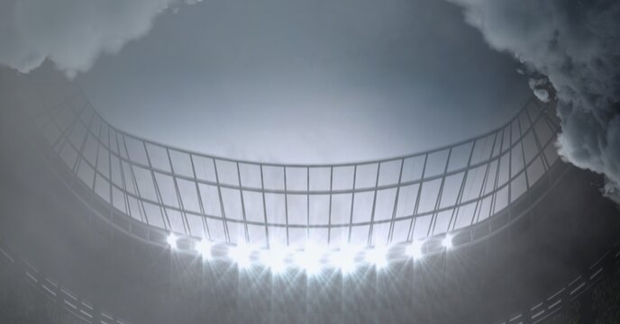 Clouds over large sports stadium with grey sky background