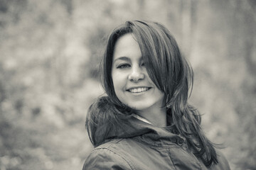 Beautiful girl on a forest background in black and white photo