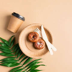 Eco friendly disposable tableware on brown background