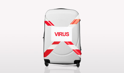Grey suitcase wrapped in red and white barrier tape