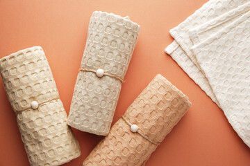 Home towels made of natural muslin in pastel shades. Natural, soft and stylish home textiles. Front view. Macro shooting. 
