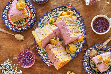 Pumpkin sponge cake with berry cream, decorated with physalis. Top view. 