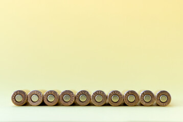 Bullets bottom on yellow background. Cartridges 7.62 caliber for Kalashnikov assault rifle closeup with copy space