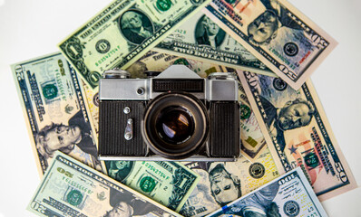 The old ruined analog camera is on the US dollar cash banknotes. Money. Camera. Photography