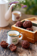 Chocolate coconut balls and coffee. Side view