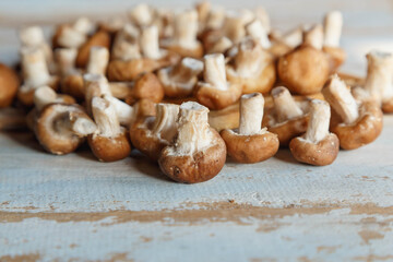 .Fresh shiitake mushrooms on the wooden kitchen table