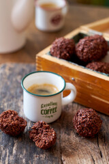 Chocolate coconut balls and coffee. Side view