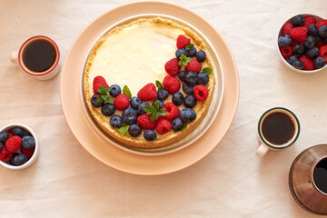 Cheesecake with berries on a white background. Top view.